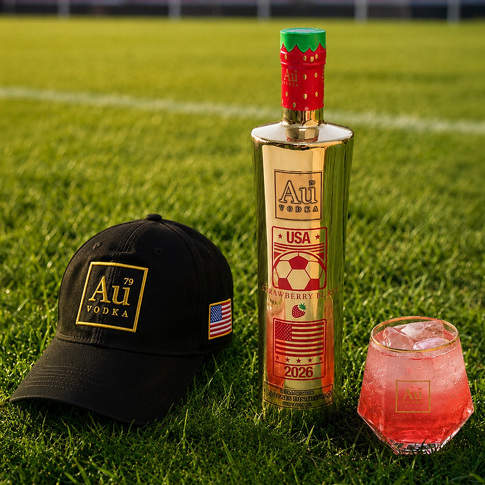 Au Vodka USA Strawberry Burst 750ml bottle, branded cap, and cocktail on grass