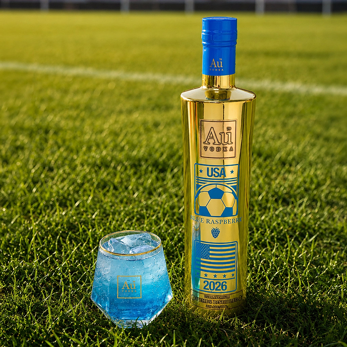 Au Vodka USA Blue Raspberry bottle and glass on a soccer field