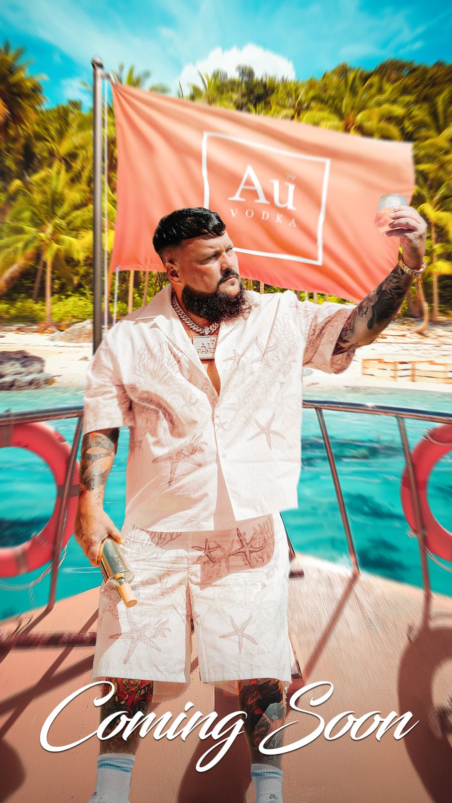 Man holding Au Vodka bottle and glass on a boat with Au Vodka flag in background
