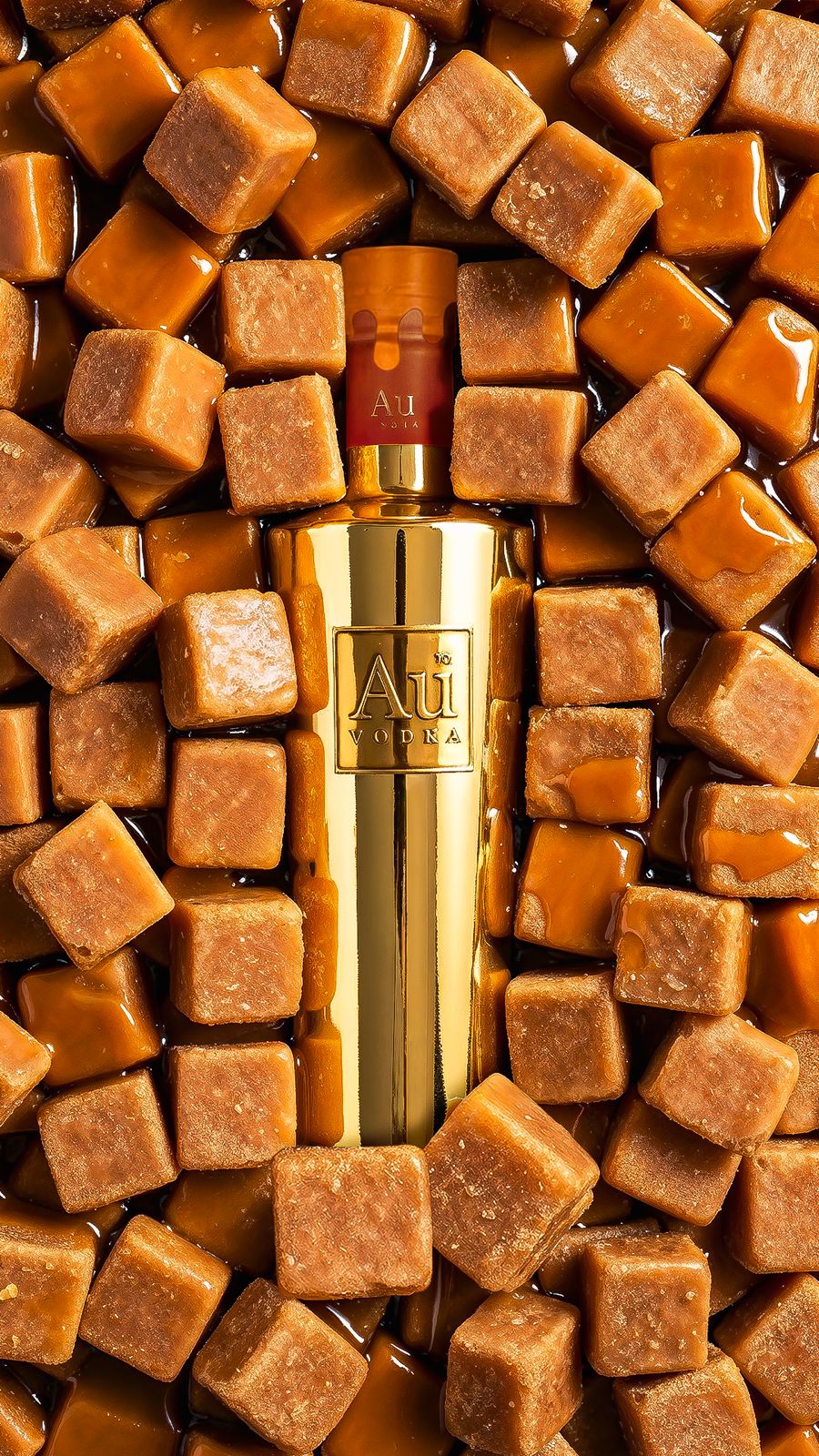 Au Vodka bottle surrounded by caramel cubes
