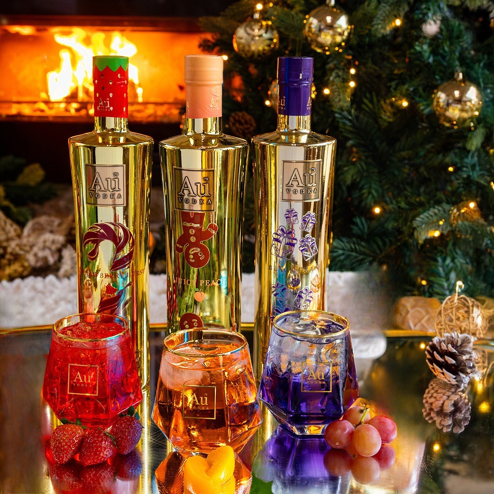 Three Au Vodka bottles and glasses with fruit in front of a fireplace and Christmas tree
