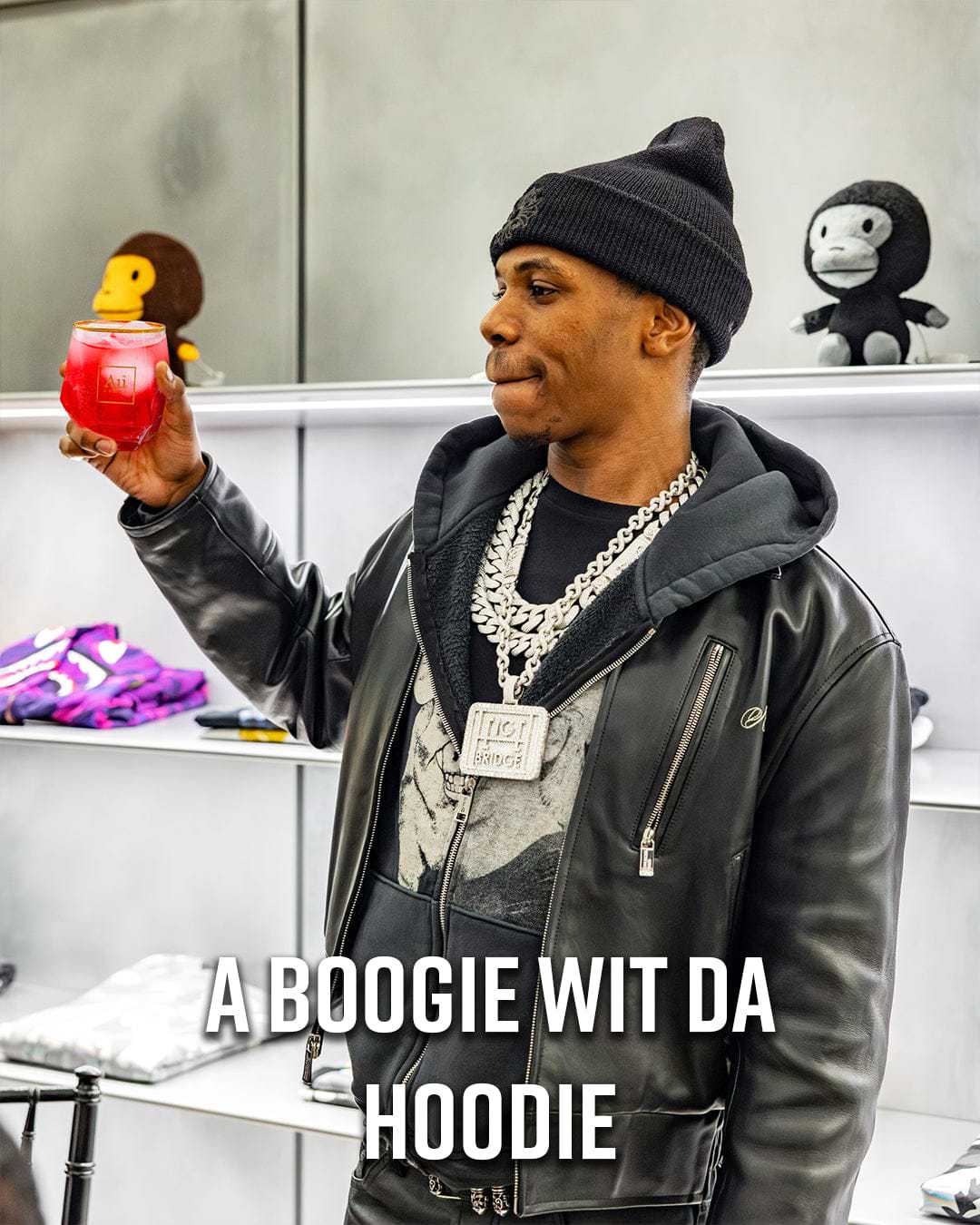 A Boogie Wit Da Hoodie wearing a black beanie, black leather jacket, and a large diamond chain