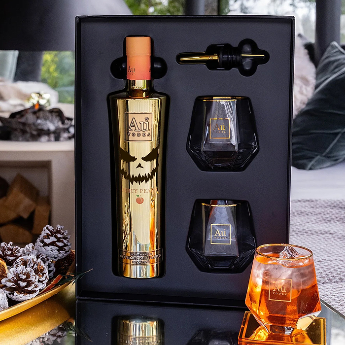 Au Vodka Juicy Peach gift pack with gold bottle two glasses and pourer in black presentation box