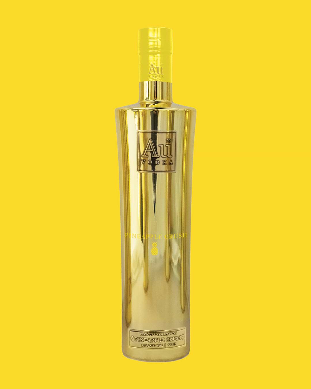 Au Vodka Pineapple Crush bottle with a yellow background