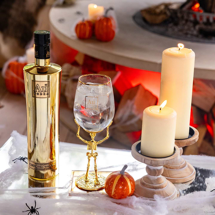 Au Vodka bottle and skeleton stem glass bundle with candles and Halloween decor