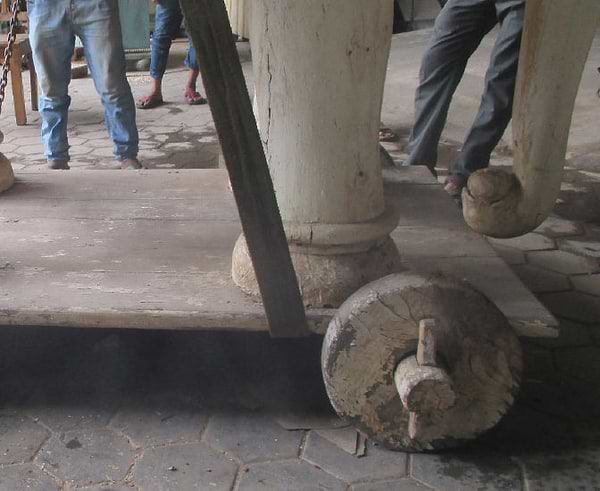 Large wooden elephant being transported