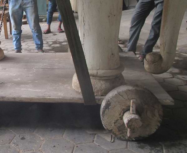 Large wooden elephant being transported