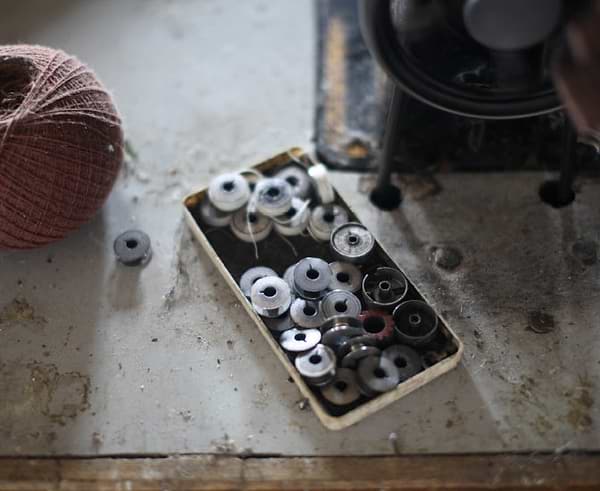 Metal bobbins in a tray