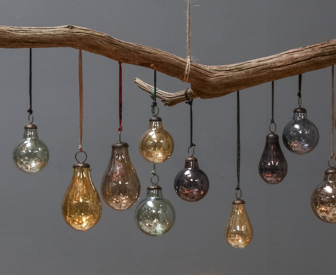 Glass baubles hanging from a branch