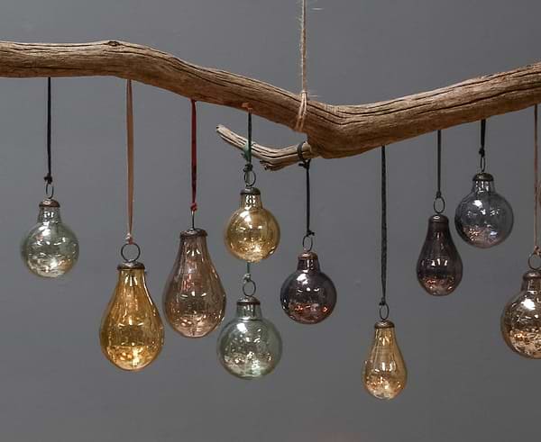 Glass baubles hanging from a branch