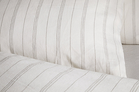 Close-up of nkukus Anta Hemp & Cotton Housewife Pillowcases in sage green, featuring a visible soft texture and slightly wrinkled surface.