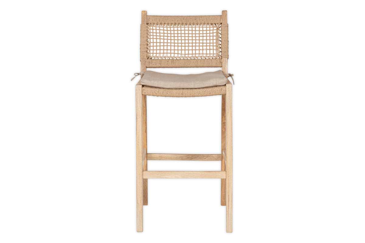 The nkuku Aamani Mango Wood & Cord Counter Chair in Natural features a minimalist design, cord backrest, beige tied seat cushion, and light mango wood finish, shown here against a white background.