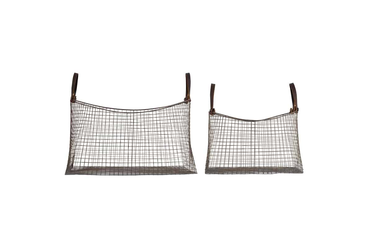 The nkuku Adah Iron Baskets - Brown (Set of 2) feature a grid pattern and brown leather handles. Displayed on a white background, these stackable baskets come in two sizes, with the larger basket shown on the left.