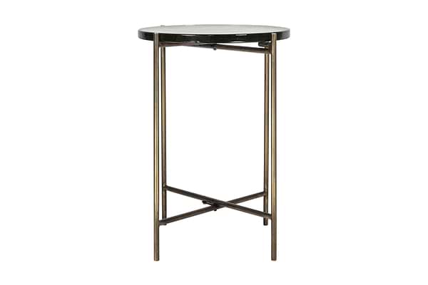 The nkuku Aluva Glass Side Table features a clear glass top with an antique brass-finished metal frame and crossed base.