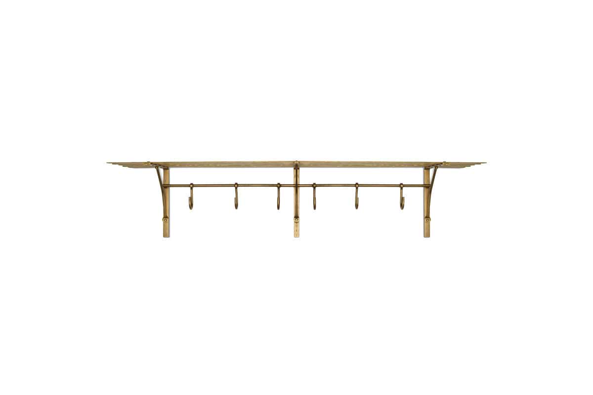 The nkuku Basti Iron Storage Shelf in Antique Brass features seven hooks and a slatted shelf, making it a stylish hallway organizer.