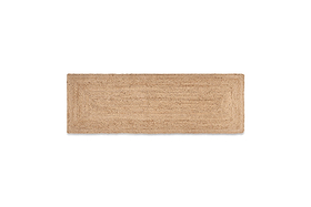The nkuku Braided Hemp Floor Runner is a rectangular, eco-friendly mat in light tan with a simple woven texture and subtle bordered design, shown on a white background.
