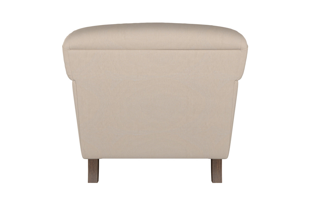 The Deni Large Corner Sofa in Brera Linen Espresso by Nkuku is displayed from the back, highlighting its soft, gently rounded top edge, smooth linen upholstery, and two short wooden legs. Centered on a white background, this piece exemplifies timeless British quality in every detail.