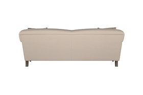 The Nkuku Deni Large Corner Sofa in Brera Linen Smoke is shown from the back, showcasing its smooth linen upholstery in a beige tone. It features gently rounded armrests and short wooden legs, while the plush backrest cushions and simple, modern lines reflect superior British quality. The sofa is set against a white background.
