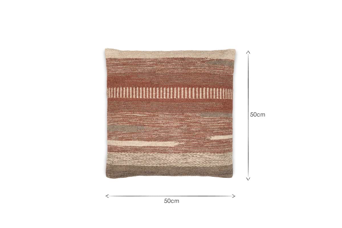 The nkuku Aakash Wool Cushion Cover - Rust is a 50x50 cm square with earthy brown, beige, and rust tones in a textured, handwoven wool blend design.