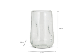 The Kotri Recycled Glass Organic Shape Vase by nkuku is shown in clear. This hand-hammered vase measures 29cm tall and 18cm wide, with black arrows indicating dimensions on a white background.
