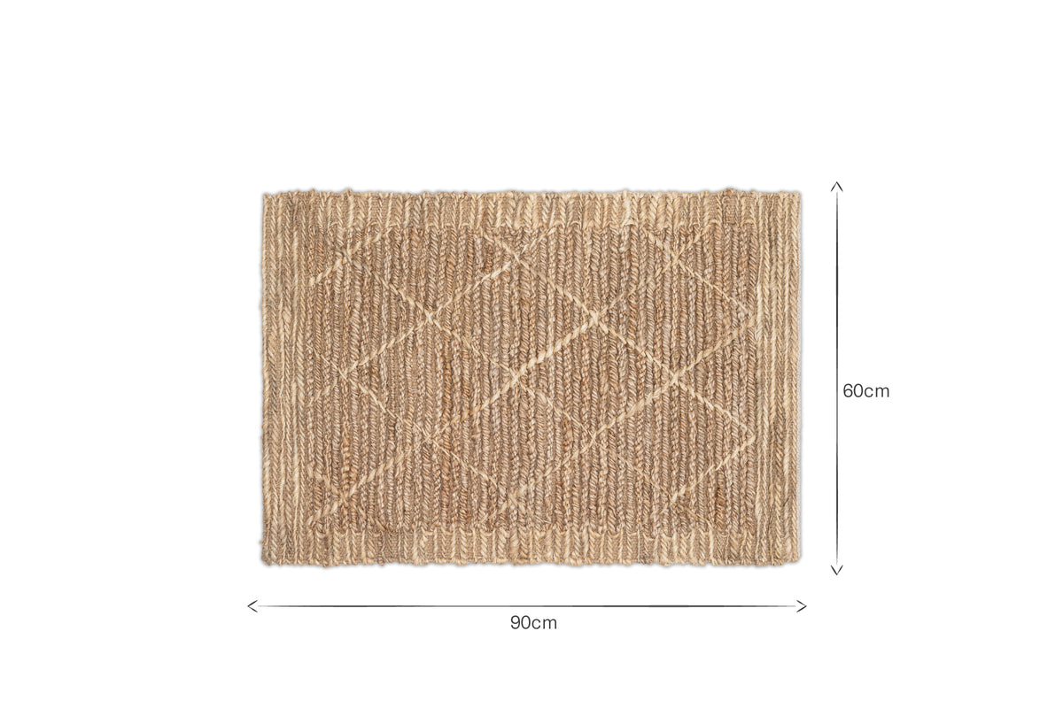 The Vandi Jute Doormat - Natural by nkuku features a subtle woven diamond pattern in brown fibers. Black text on a white background shows its size: 90cm wide by 60cm tall, highlighted by two arrows.