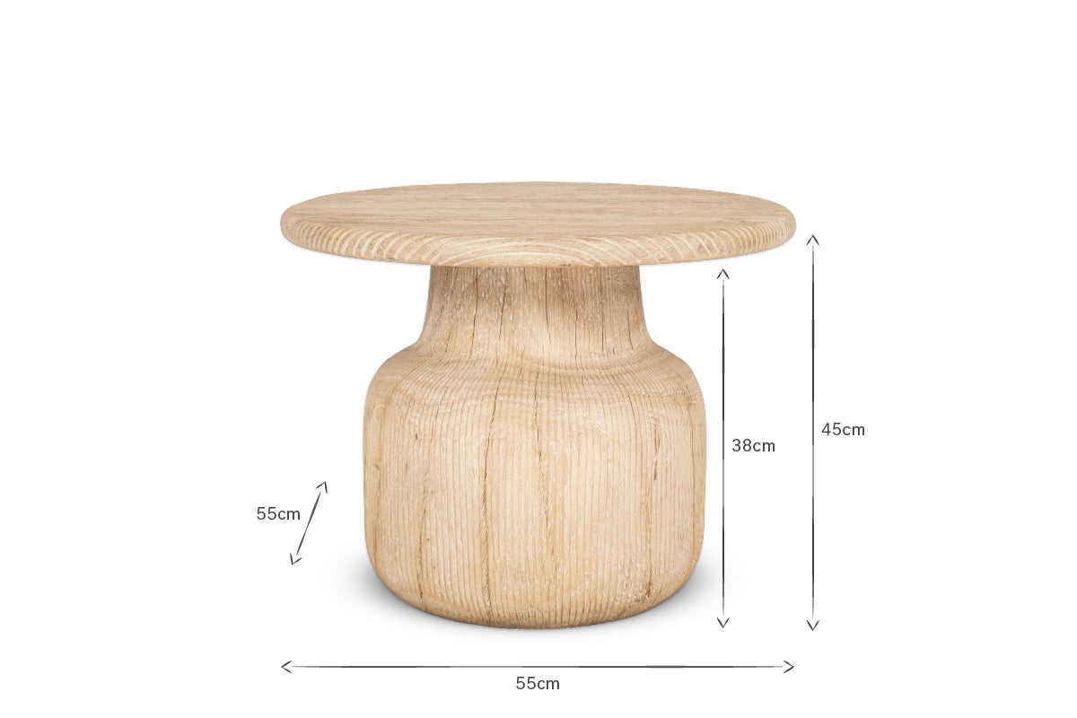 The nkuku Vivan Grooved Wood Side Table is a round, light coffee table made from sustainable mango wood with a grooved cylindrical base and natural finish. Dimensions: 55cm wide, 45cm tall; base section is 38cm high.