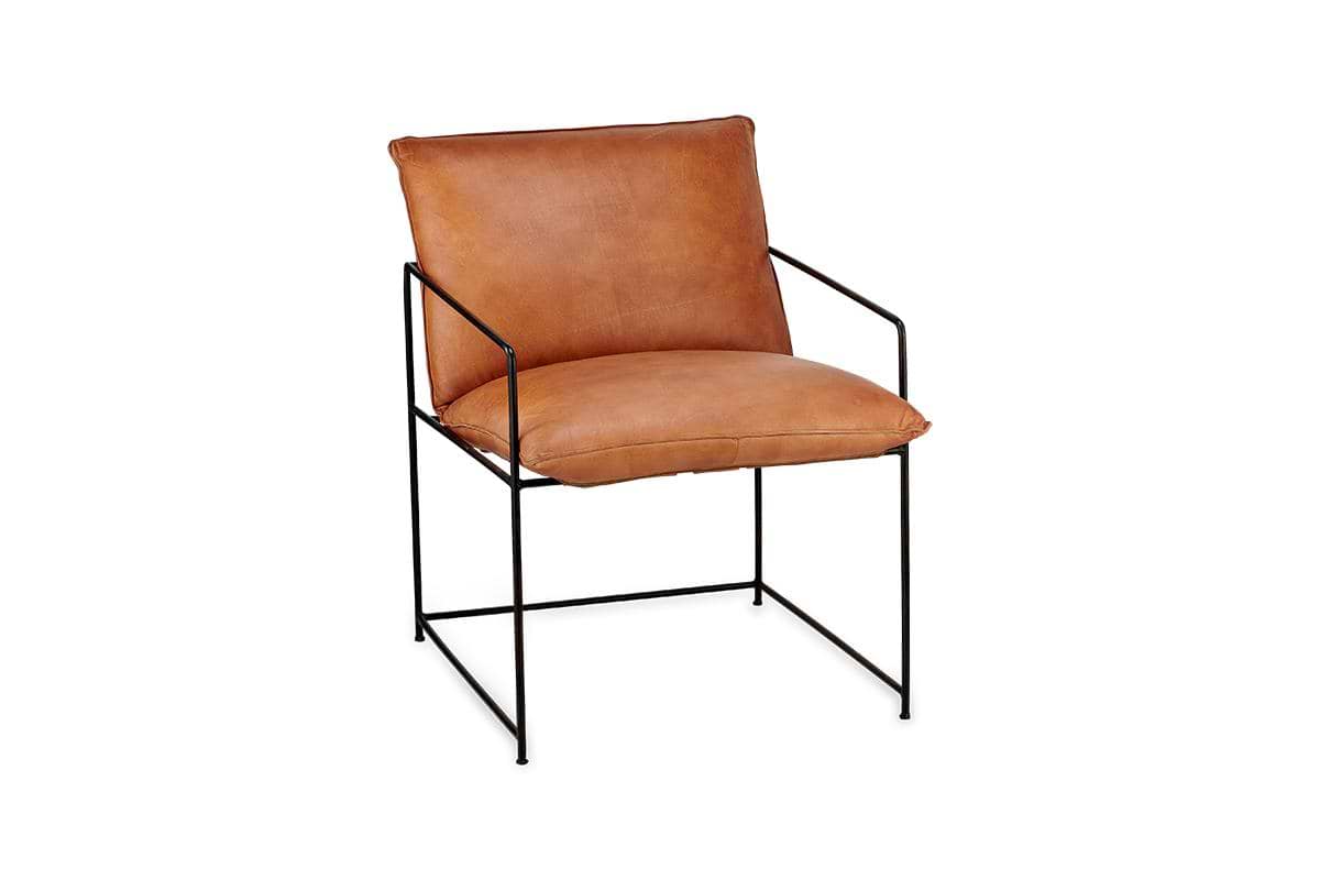 The nkuku Durium Leather Lounger - Aged Tan features a tan leather seat and backrest, minimalist iron frame, and slim armrests, combining modern style with industrial design against a sleek white backdrop.