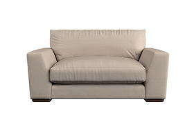 A contemporary beige loveseat with plush cushions and wide armrests sits low on dark wooden feet, featuring a soft, heavyweight washed linen upholstery and a minimalist design that reflects British craftsmanship. Perfect for modern living rooms, it pairs beautifully with the Nkuku Guddu Large Right Hand Chaise Sofa in Brera Linen Indigo to create an elevated yet comfortable space.