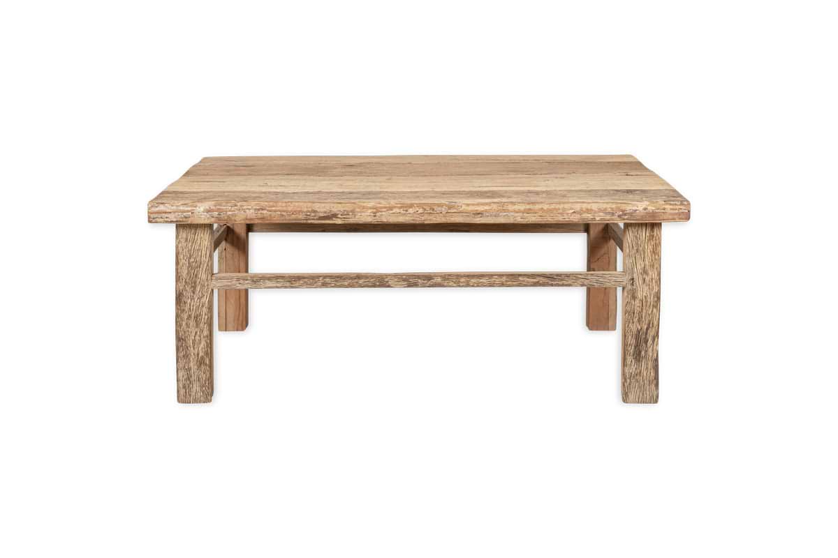 The nkuku Ibo Reclaimed Wood Coffee Table - Natural features a rustic finish, sturdy thick legs with a horizontal support bar, and visible wood grain that showcases Indian artisan craftsmanship. Photographed on a plain white background.