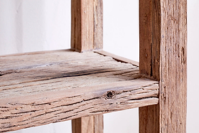 Close-up of the nkuku Ibo Reclaimed Wood Shelf - Natural - Wide, showcasing its rustic design, weathered wood grain, and distinctive knot details on the reclaimed wood shelf and frame.