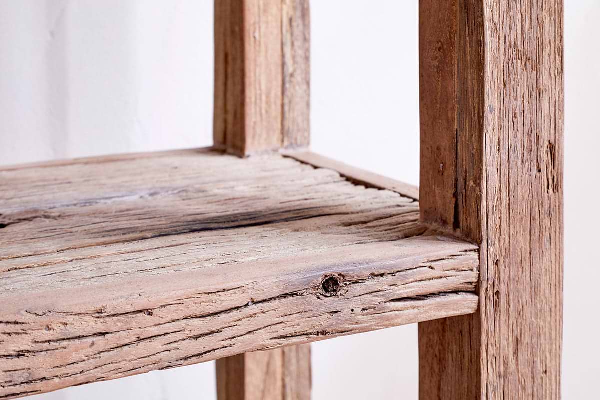 Close-up of the nkuku Ibo Reclaimed Wood Shelf - Natural - Wide, showcasing its rustic design, weathered wood grain, and distinctive knot details on the reclaimed wood shelf and frame.