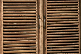 The nkuku Ibo Reclaimed Wooden Slatted Cabinet – Natural (Large) features rustic metal handles and highlights Indian artisan craftsmanship.