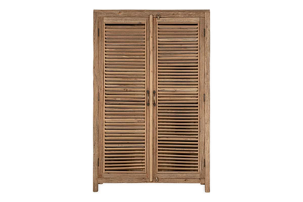 The Ibo Reclaimed Wooden Slatted Cabinet – Natural - Large by nkuku features two shutter-style doors with horizontal slats, a natural wood finish, simple handles, four short legs, and minimalist Indian artisan-inspired design.
