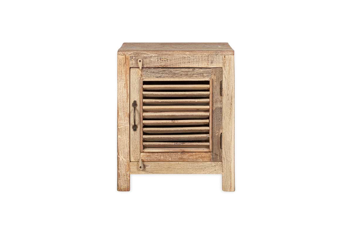 The nkuku Ibo Reclaimed Wooden Slatted Cabinet – Natural - Small features a single slatted door, distressed light wood with visible grain and knots, a square design, and a metal latch, showcasing Indian artisan craftsmanship.