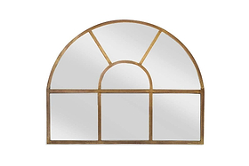 The Imoma Iron Overmantel Arch Mirror by nkuku features a brass-finished mirrored glass frame and windowpane design. Its semi-circular top and panelled rectangle base make it an elegant choice to reflect light in any room.