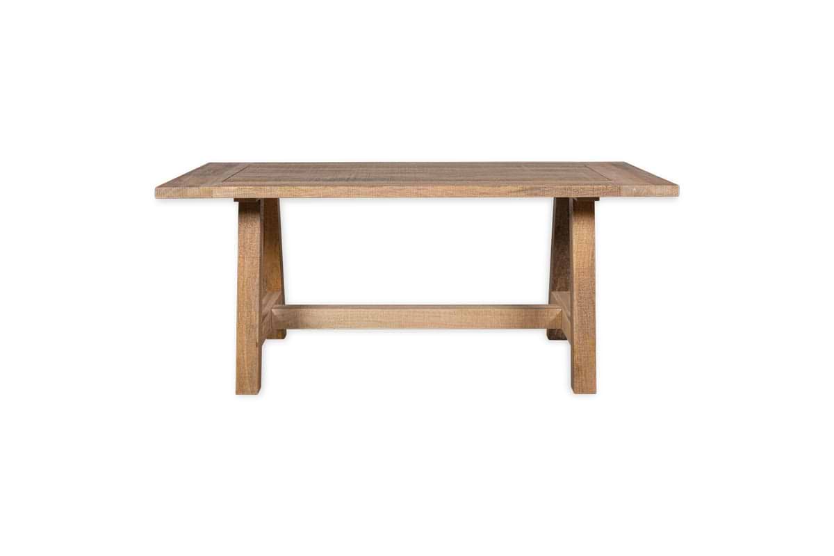 The nkuku Indali Mango Wood Dining Table - Natural features a rectangular, weathered mango wood top and sturdy tapered legs with a lower stretcher—an ideal sustainable choice for cozy spaces.