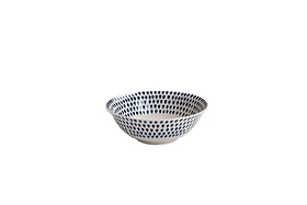 The Indigo Drop Dinnerware Set - Cream & Indigo by nkuku includes 12 handmade ceramic pieces from Vietnam, each featuring hand-painted blue dots on gently sloping sides, inspired by traditional Indigo Drop designs.