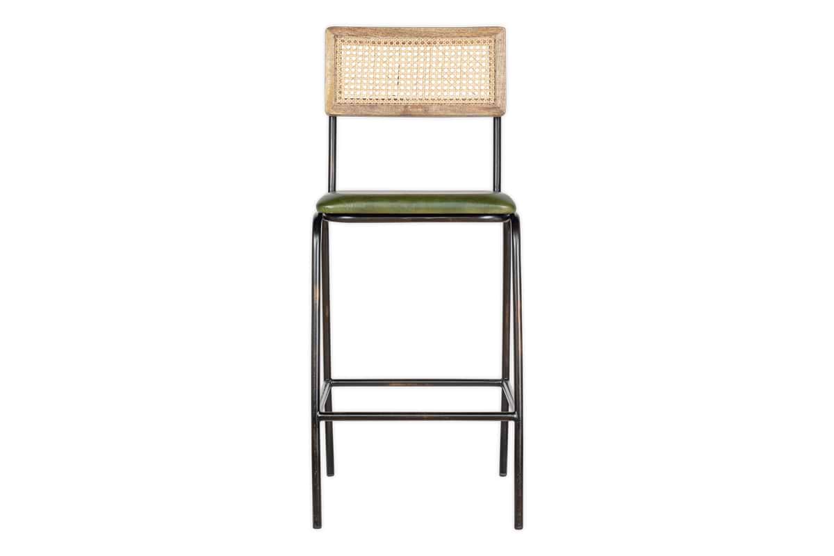 The Iswa Leather & Cane Counter Chair by nkuku features a distressed metal frame, rich green leather seat, and stylish woven cane back for added comfort.