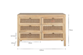 The Kanz Mango Wood Chest Of Drawers by nkuku features six spacious drawers in two columns, each with woven rattan cane panels and round knobs. Made of light mango wood. Size: 120cm W x 79cm H x 45cm D; drawers: 49cm x 14.5cm.
