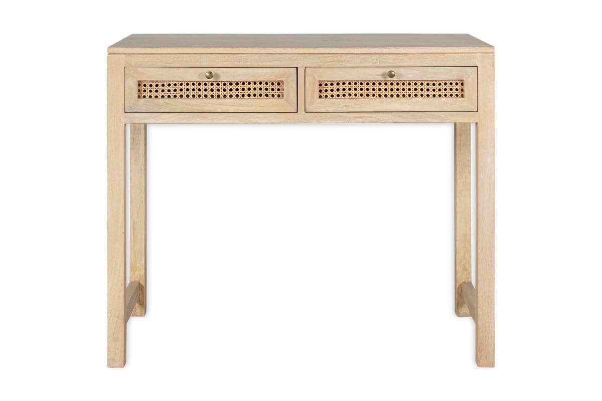 The nkuku Kanz Mango Wood Writing Desk features a natural finish, two front woven cane drawers with round knobs, simple straight legs, and a flat surface for a minimalist, modern look.