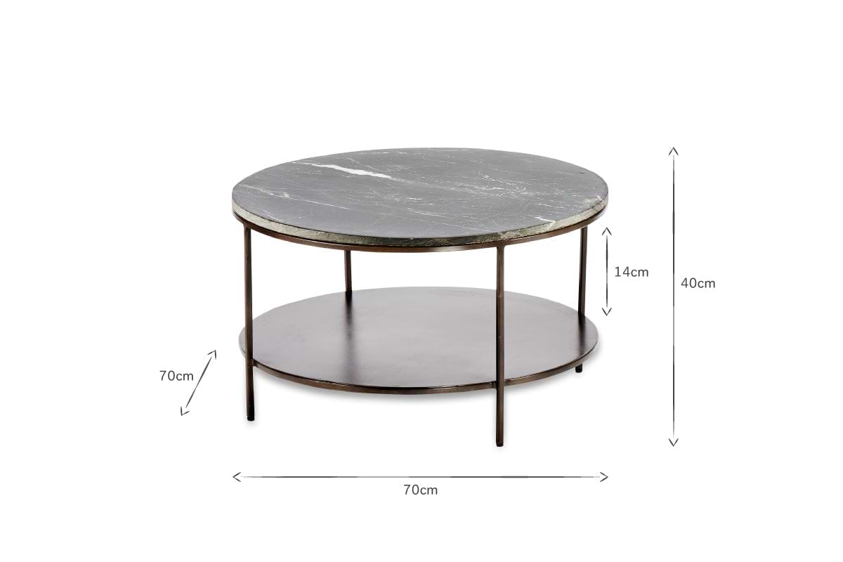 The Karoko Marble Coffee Table by nkuku features a round black marble top, slim iron legs, and a lower metal shelf set 14cm below. Measuring 70cm in diameter and 40cm tall, it boasts a simple, modern design.