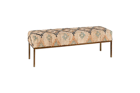 The Kesu Kilim & Iron Bench by nkuku features a rectangular seat upholstered in peach, teal, and black kilim-style fabric with geometric patterns, set on a slim iron frame with four straight legs.