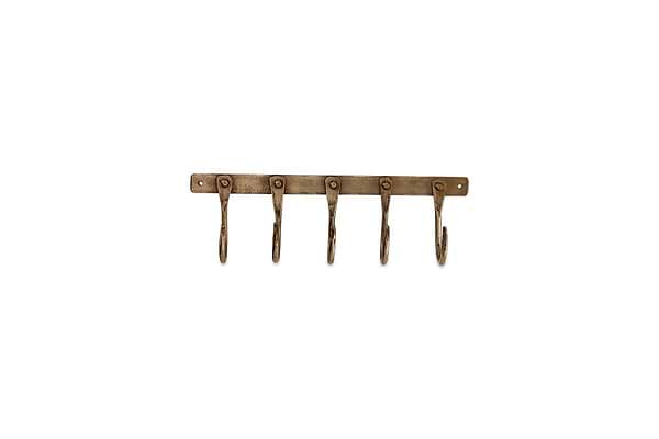 The nkuku Kuna Iron Hooks in antique brass offer five wall-mounted hooks with rounded ends for compact storage. An industrial vintage look is highlighted by a sturdy bar and end screw holes for secure mounting.