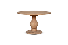 The nkuku Laya Round Carved Mango Wood Table - Small features a smooth, natural light-finished top and a single thick, hand-carved pedestal base, shown on a solid base against a white background.