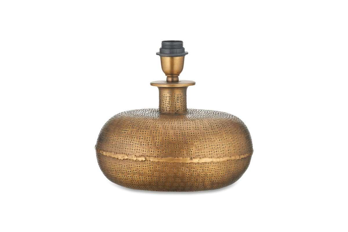 The Lumbu Lamp - Antique Brass - Small by nkuku features a rounded, textured base with a hammered finish, narrow neck, and black holder. Its dotted patterns give an antique, handcrafted look—ideal for decorative lighting against white backgrounds.