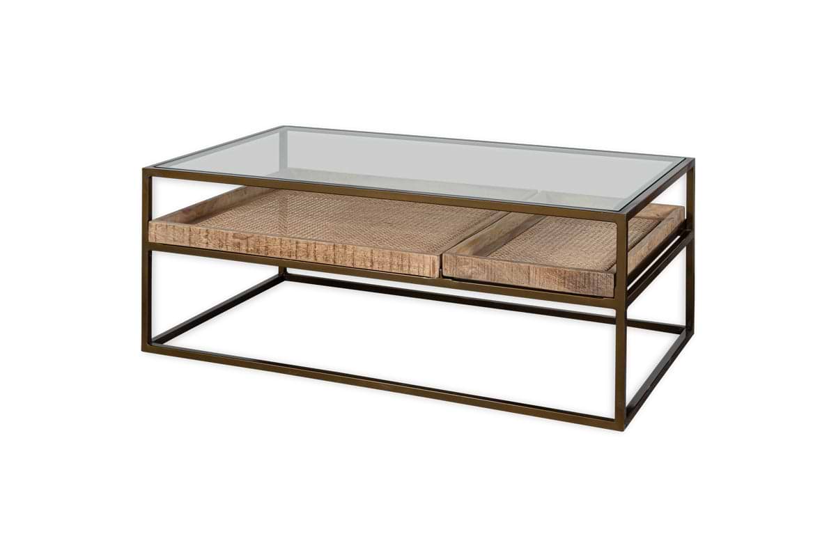 The nkuku Luzon Iron & Mango Wood Display Coffee Table in Brass features a clear glass top, metal frame, and two elegant woven cane trays on the lower shelf for storage and display, one larger than the other.