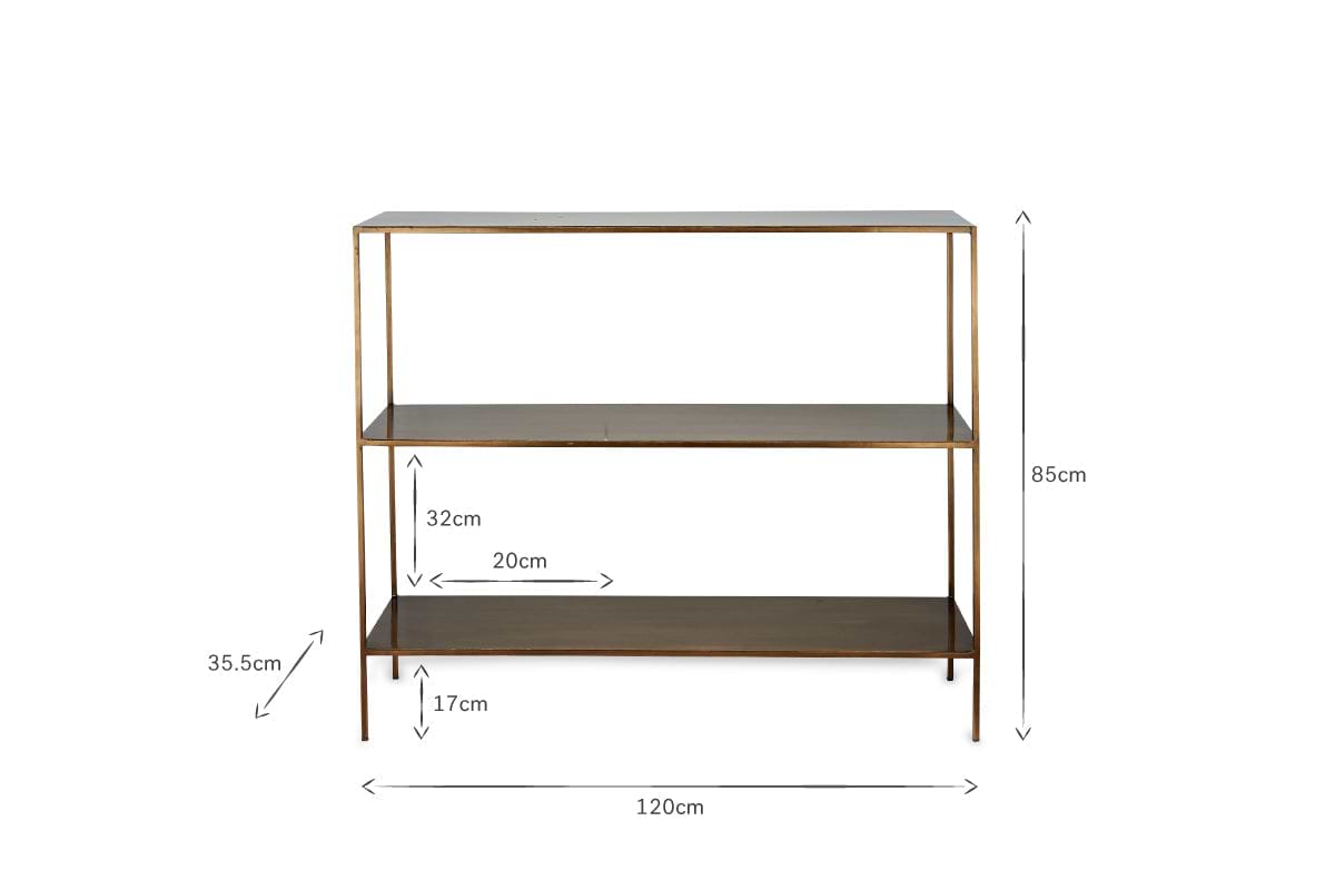 The Mahi Console Table by nkuku features a slim brass-colored frame and dark shelves. Measuring 120 cm wide, 85 cm tall, and 35.5 cm deep, it’s a stylish choice for use as a hallway sideboard or elegant display piece.