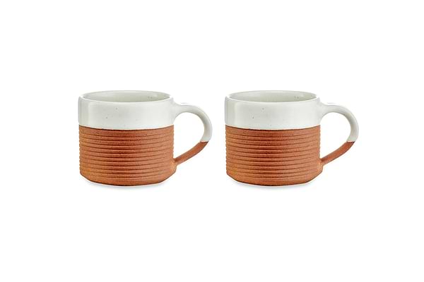 The nkuku Mali Ribbed Coffee Mug - White (Set of 2) features handmade ceramic mugs with a white speckled glaze on top and ribbed terracotta below, plus small loop handles. Stylish two-tone design, shown on a white background.