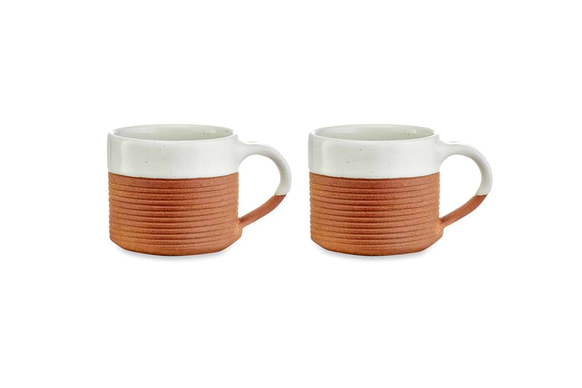 The nkuku Mali Ribbed Coffee Mug - White (Set of 2) features handmade ceramic mugs with a white speckled glaze on top and ribbed terracotta below, plus small loop handles. Stylish two-tone design, shown on a white background.