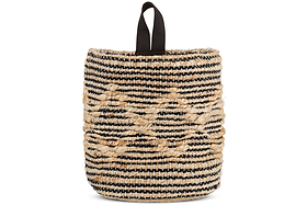 The nkuku Mannu Cotton & Hemp Wall Hung Basket in natural and black features coarse, handwoven horizontal stripes, a loop handle for easy wall hanging, and raised diamond patterns crafted from thick beige fibers. Perfect as handmade storage.